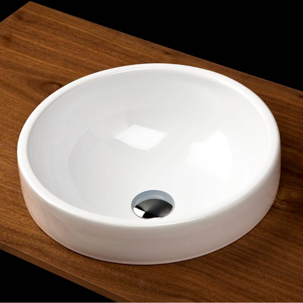 Lacava Self-rimming porcelain Bathroom Sink  with an overflow.Finished back. 16 3/4''DIAM, 6 3/8''H